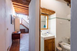 a bathroom with a sink and a toilet at Appartamento Nobile Murlo in Murlo +37 photos
