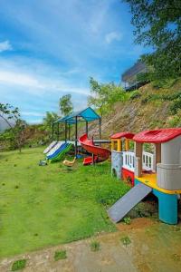 a group of playground equipment in a field at Nang Villa HA in Yên Bài