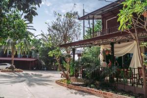 a building with a canopy outside of it at ชลธี รีสอร์ท in Maha Sarakham