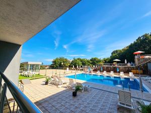 a view of a pool from a balcony of a hotel at Europroperties Yalta Apartments in Golden Sands