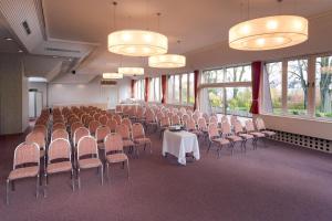 a conference room with chairs and a table and lights at Hotel Parc Belle-Vue in Luxembourg