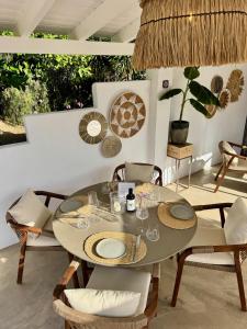 a dining room with a table and chairs at Vida Lenta Boutique Finca in Alora