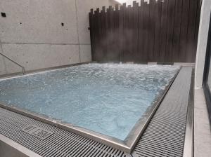 a large pool of water in a building at rocking home in Aschau
