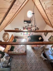 an overhead view of a loft bedroom with a chandelier at Rozkoszne Roztocze - domek na wynajem in Staw Noakowski