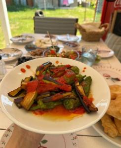 a plate of food on top of a table at Bergüzar Hanım Konukevi in Gokceada Town +8 photos