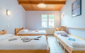 a room with two beds and a window at Azureva Club Longeville-sur-Mer in Longeville-sur-Mer +26 photos