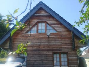 a log house with windows on the side of it at Holzhaus Rheingoldstraße 49a in Urbar +8 photos