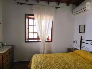 a bedroom with a bed and a window at Fide in Tijarafe +22 photos