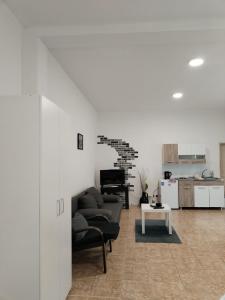 a living room with a couch and a table at Sobe Išić in Veliko Gradište