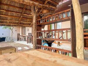 a room with a wooden fence and windows at Mahagedara Villa Wilpattu in Nochchiyagama