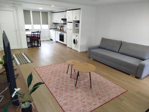a living room with a couch and a table at La casa de Carmen in Neda