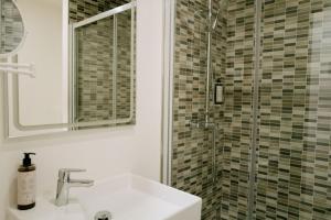 a bathroom with a sink and a shower at Hotel Rosamar - Emar Hotels in Es Pujols