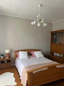 a bedroom with a bed and a ceiling fan at Corps de ferme à 50min de Lyon in Moissieu-sur-Dolon