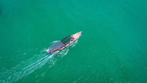 a boat in the middle of the water at Koh Sdach Resort by EHM in Kaoh Sdach