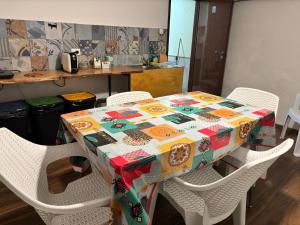 a table with a quilt on it in a kitchen at Casa Felice in Senigallia +47 photos