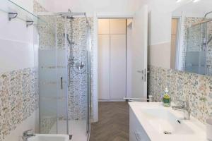 a bathroom with a shower and a sink at Casa Turchese in Alghero +19 photos