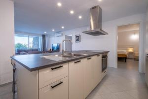 a kitchen with a sink and a counter top at Residence Sole Dell'Argentario in Porto Santo Stefano