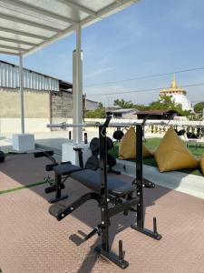 a room with two chairs and a table on a patio at REST IS MORE hostel in Bangkok