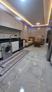 a kitchen with a washer and dryer in a room at Gite El Menzeh in Moulay Idriss +71 photos