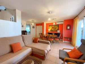 a living room with a couch and a dining room at Playa de Baria I in Vera +25 photos