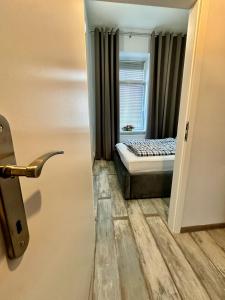 a small bedroom with a bed and a window at Royal City Centre Apartment - 2 Bedrooms 72 m2 - AC - Balcony - Coffee Machine - Washer - Dryer -Parking available Free public or Paid Private for 20 euro per stay Please read our emails in Poprad