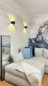 a living room with a couch and a painting at Costa Blanca Międzyzdroje - Holiday Home in Międzyzdroje +41 photos