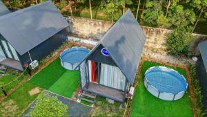 an overhead view of a house with two swimming pools at Mekong Hotel in Tây Ninh
