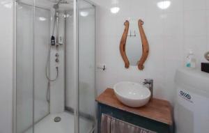 a bathroom with a shower and a sink and a glass shower stall at Uplandhytta in Ringsaker +12 photos