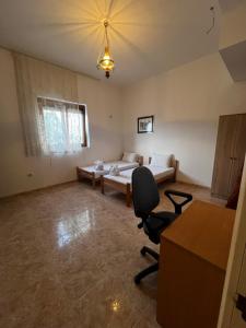 a living room with a couch and a chair at Obala Ineks in Sutomore +2 photos