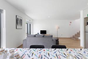 a living room with a couch and a table at Manuel'shouse in Vila Nova de Gaia