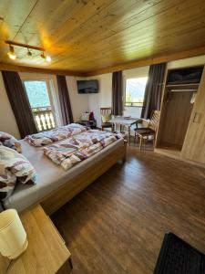 a bedroom with a large bed in a room at Landhaus Aigner in Mittersill