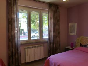 Posteľ alebo postele v izbe v ubytovaní Elisir b&b