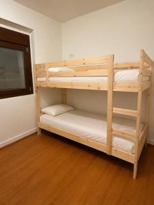 a couple of bunk beds in a room at Jaca Stone in Banaguás