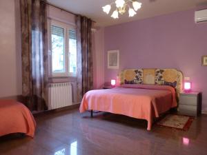 Posteľ alebo postele v izbe v ubytovaní Elisir b&b
