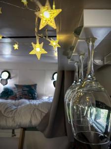 a room with a bed and a vase with stars on the ceiling at Solar Powered Hideaway converted horse box in Fishbourne