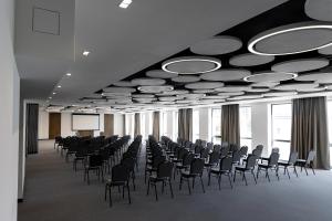 a large room with chairs and a projection screen at Житомир by Optima in Zhytomyr