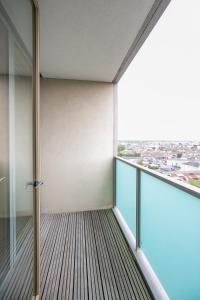 an empty balcony with a view of a city at IFSC Townhouse Apartments in Dublin