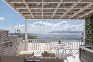 a view of the ocean from the balcony of a house at Santana Beach in Agia Anna Naxos