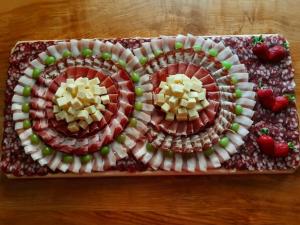 a platter with two plates of food on a table at Raj pod Košenjakom in Dravograd