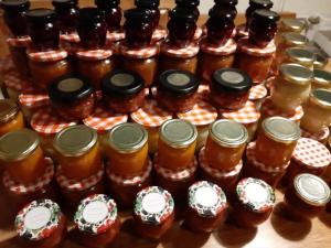 a group of jars of honey on a table at Raj pod Košenjakom in Dravograd