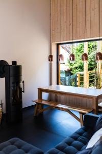 a living room with a table and a fireplace at Zastávka Vlkov in Vlkov