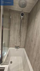 a shower in a bathroom with a bath tub at Karadow in Saint Just in Roseland +34 photos
