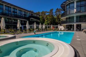 a large swimming pool in front of a building at Apartament Bursztynowa Komnata 117 Stegna nad morzem in Stegna