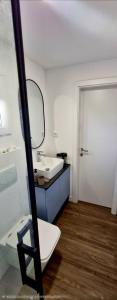 a bathroom with a sink and a mirror at Mobile Homes Gasperino in Pirovac