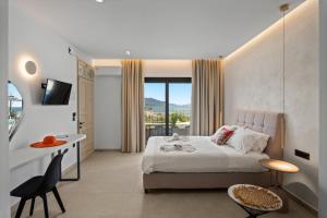 a hotel room with a bed and a balcony at Giorgos apartments in Dassia +43 photos