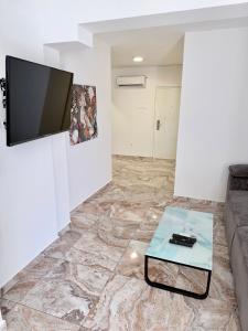 a living room with a couch and a glass table at Vip Villa Tina in Novalja