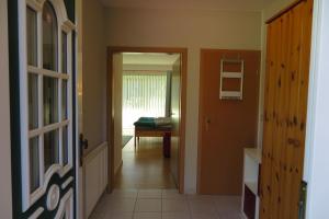 a hallway with a door leading to a bedroom at Apartment "An der Süderschmiede" in Sieverstedt +5 photos