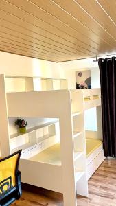 a white bunk bed in a room at Private Studio Apartment with Balcony in Dortmund-Brackel in Dortmund