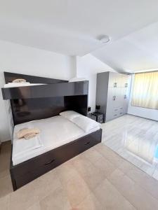 a bedroom with a large bed in a room at Vip Villa Tina in Novalja +23 photos