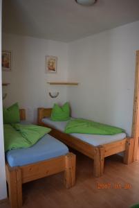 Postel nebo postele na pokoji v ubytování U Oslíka